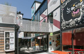 Laneways and an overhead walkway within BOXed Quarter in Christchurch.