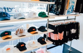 Hats and shorts on display inside Crate clothing store Hamilton.