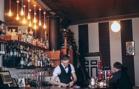 A man working behind the bar.