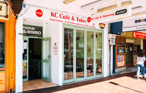 The white and red exterior of K C Cafe in Wellington.
