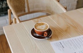 A close up of a flat white on a table at Mint Folk and Co in Twizel.