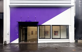 The purple and white exterior of Sumer gallery in Auckland.