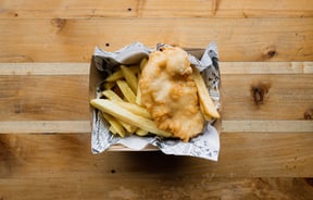 A small box of fish and chips.