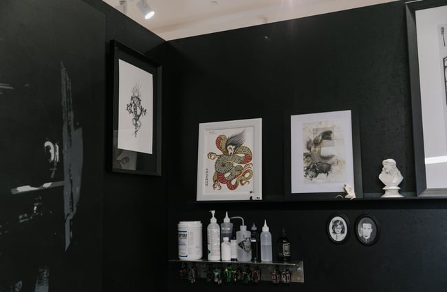 Framed tattoo art on the wall Absolution Tattoo and Body Piercing studio in Christchurch.