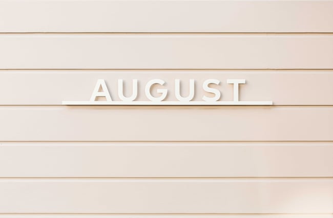 The 'August' sign on an exterior wall.