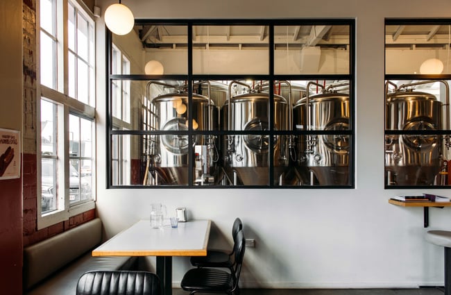 A look through windows inside the brewing room.
