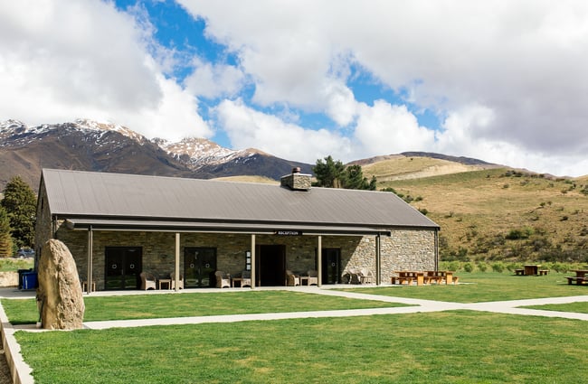 Cardrona Distillery in front of the mountains.