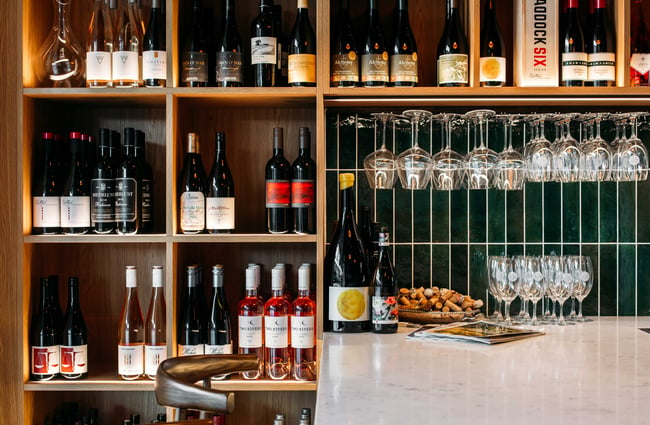 Wine and wine glasses on display.