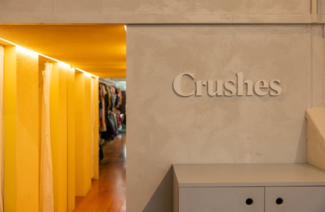 Crushes logo on the wall in front of the changing rooms.