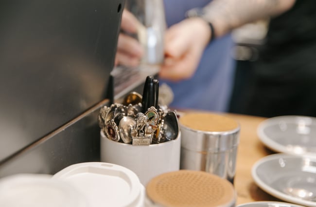 Close up of teaspoons in a jar at Dispense Espresso in Christchurch.