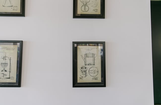 Coffee pot artwork framed on the wall at Dispense Espresso in Christchurch.