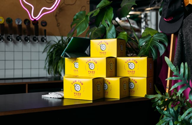 A close up of yellow boxes stacked on top of each other.