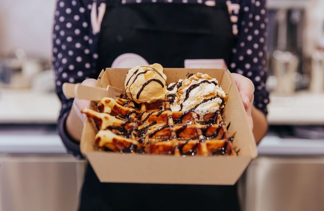 Waffle with scoop of gelato on top.