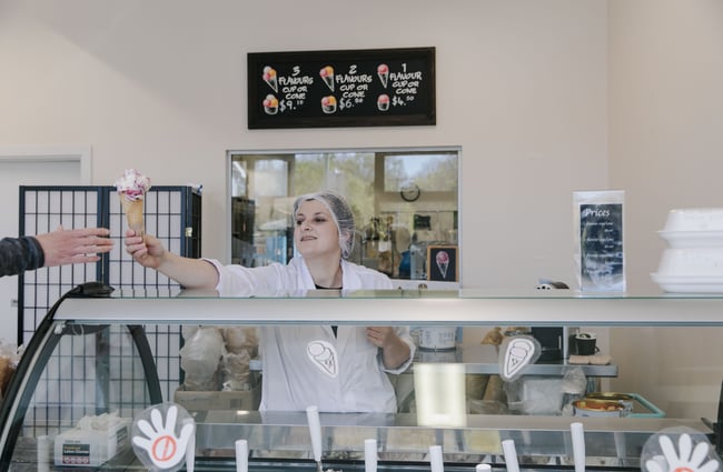 Woman handing over a gelato cone at Gelato Lab in Christchurch. .