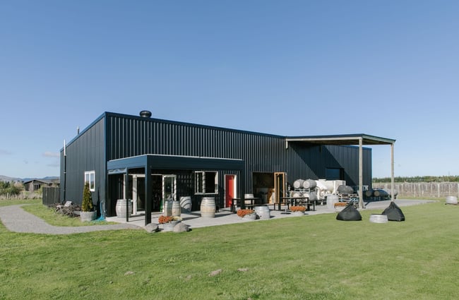 The black exterior of Georges Road winery on a sunny clear day.