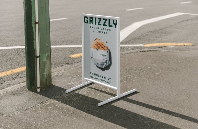 Footpath sign outside Grizzly Baked Goods in Christchurch.