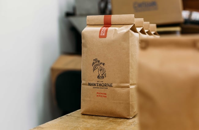 A paper bag of Hawthorne Coffee.