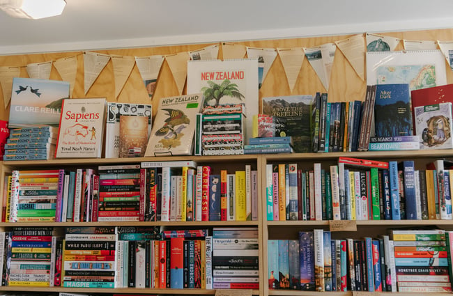 Close up of new books on bookshelves inside the Hydro Café bookshop in Twizel.