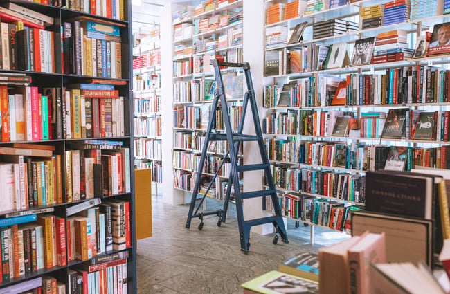 Blue ladder used for retrieving books at Lamplight Books, Auckland.