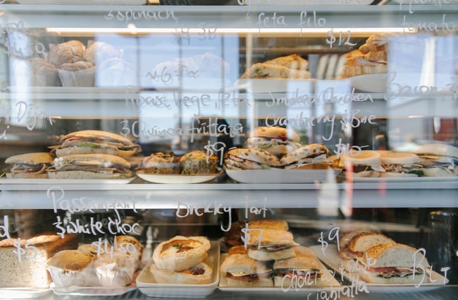 Food on display in a cabinet at Little Vintage Espresso cafe Amberley, North Canterbury.