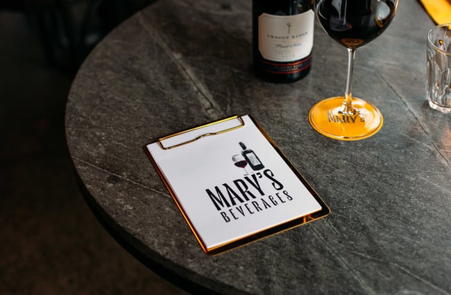 A close up of Mary's beverage menu on a table.