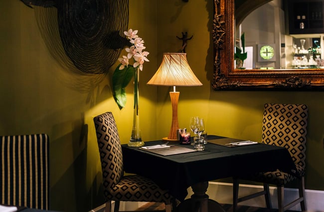 A cosy corner in the darkly lit dining room.