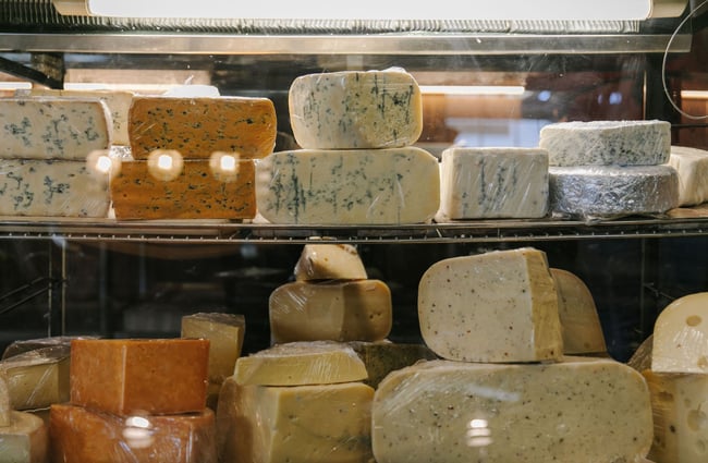 Cheeses on display in fridge at Old Factory Corner, Nelson Tasman.