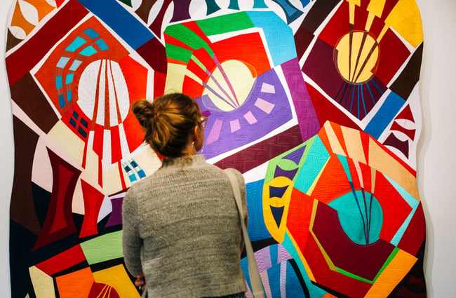 Woman enjoying colourful art work.