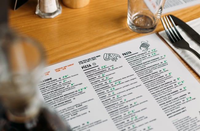 A close up of a menu on a table.