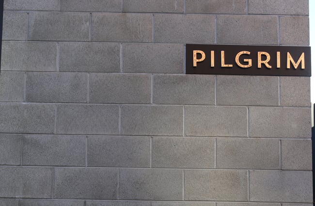 Pilgrim sign on concrete blocks.
