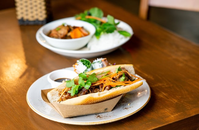 A Banh Mi sitting on a table at Sen restaurant In Auckland.