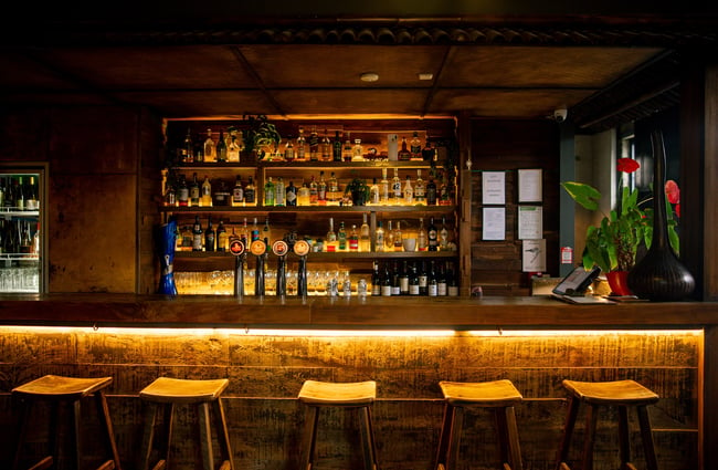 The dimly lit bar of Sen Kitchen in Auckland.