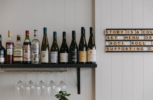 Bottles of wine on a shelf at Story.