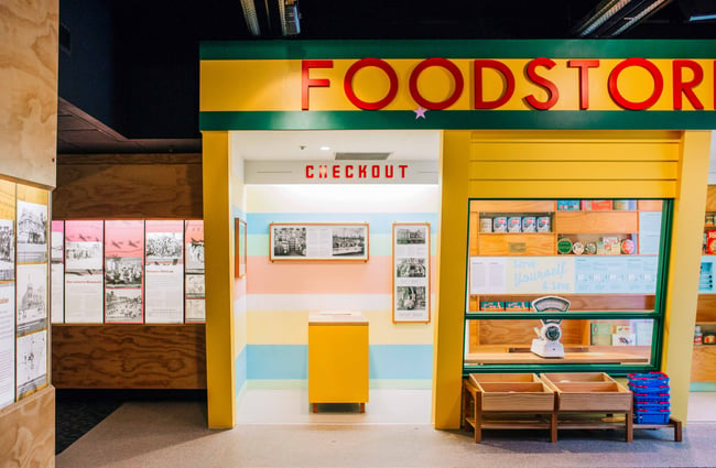 A yellow and green exterior of the retro food store.