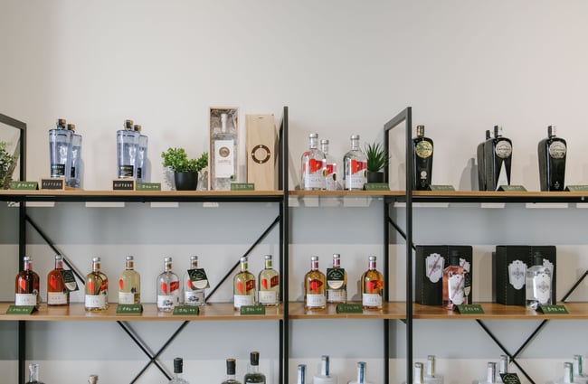 Bottles of gin on shelves to The Juniper Collective, Christchurch.