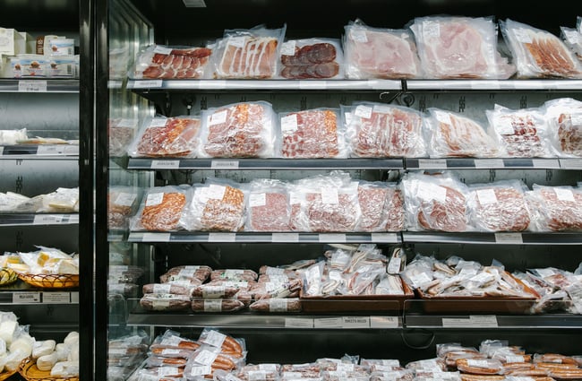 Fridges of cured meats and salamis at Mediterranean Food Company, Christchurch.