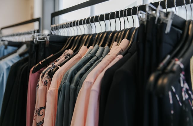 Close up of clothing on a rack.