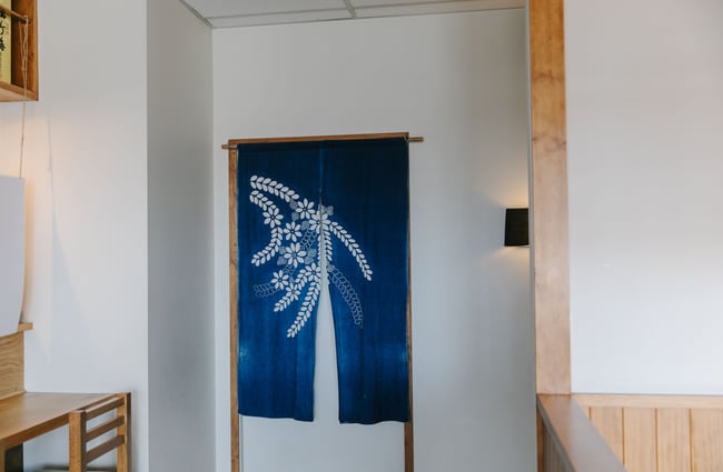 Blue Japanese flag as a feature on the wall.