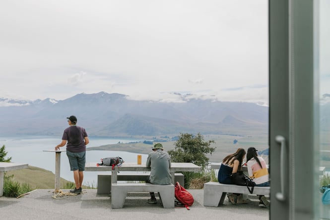 People looking out to the mountain views at Astro Cafe, Tekapo.
