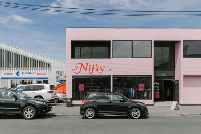 The pink block exterior of Nifty in Christchurch.