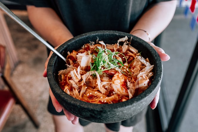 A bowl of sizzling bibimbap slathered in house-made gochujang sauce from Simon and Lee.