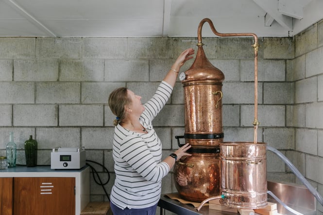 Lady working in the Mt Fyffe Distillery.