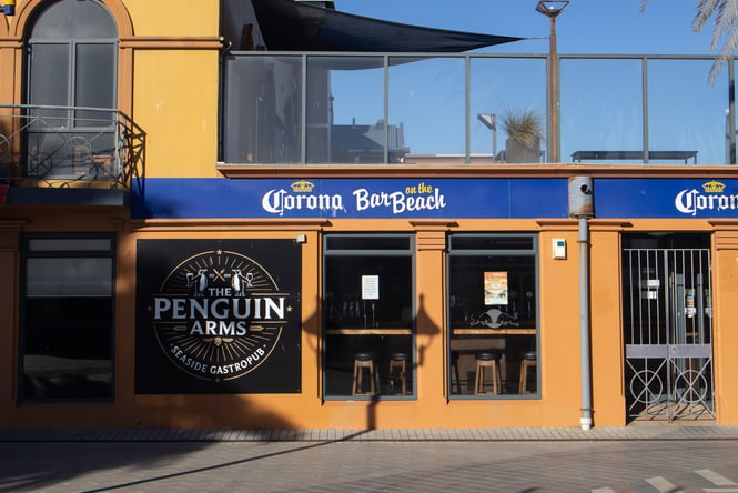 A view of the outside of Penguin Arms on a sunny day.
