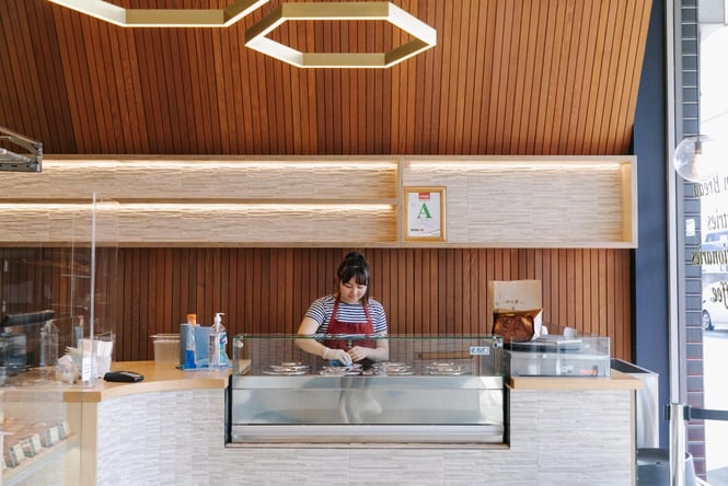 A staff member working behind the counter.