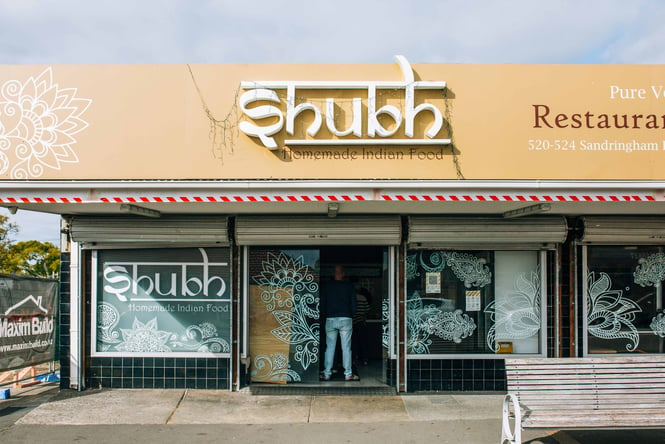 The entrance to Shubh restaurant in Auckland on a sunny day.