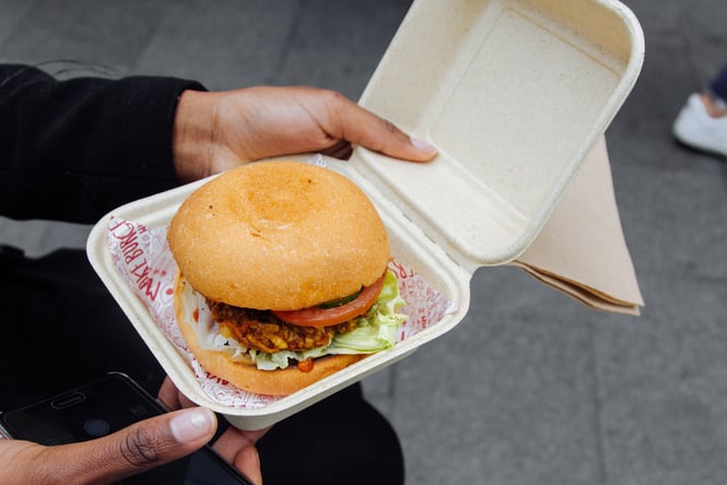 A burger in a cardboard box.