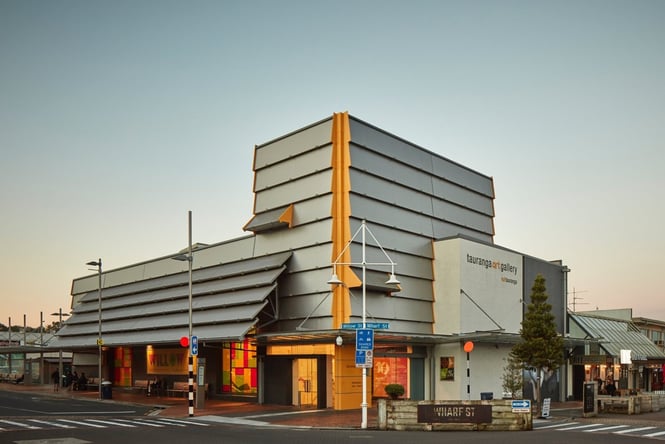 The exterior of the Tauranga Art Gallery at dusk.