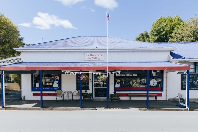 The blue, red and white exterior of an old building in Akaroa.