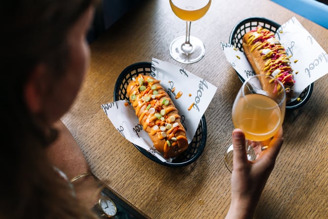 An image of wine and sauce covered hot dogs.