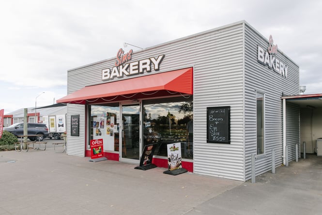 The silver and red exterior of Sim's Bakery in Ashburton.